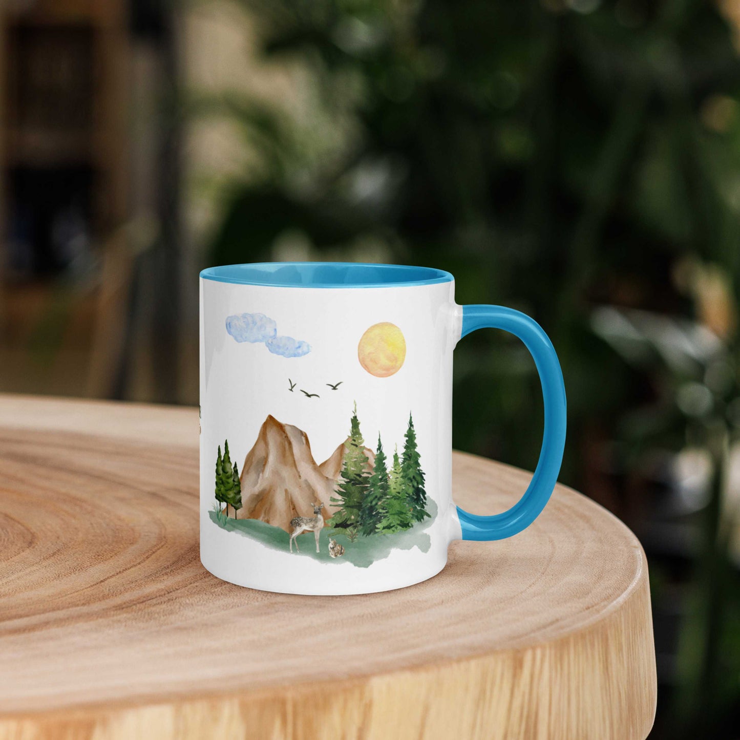 Ceramic Mug featuring a nature scene with trees, mountains, and a deer.