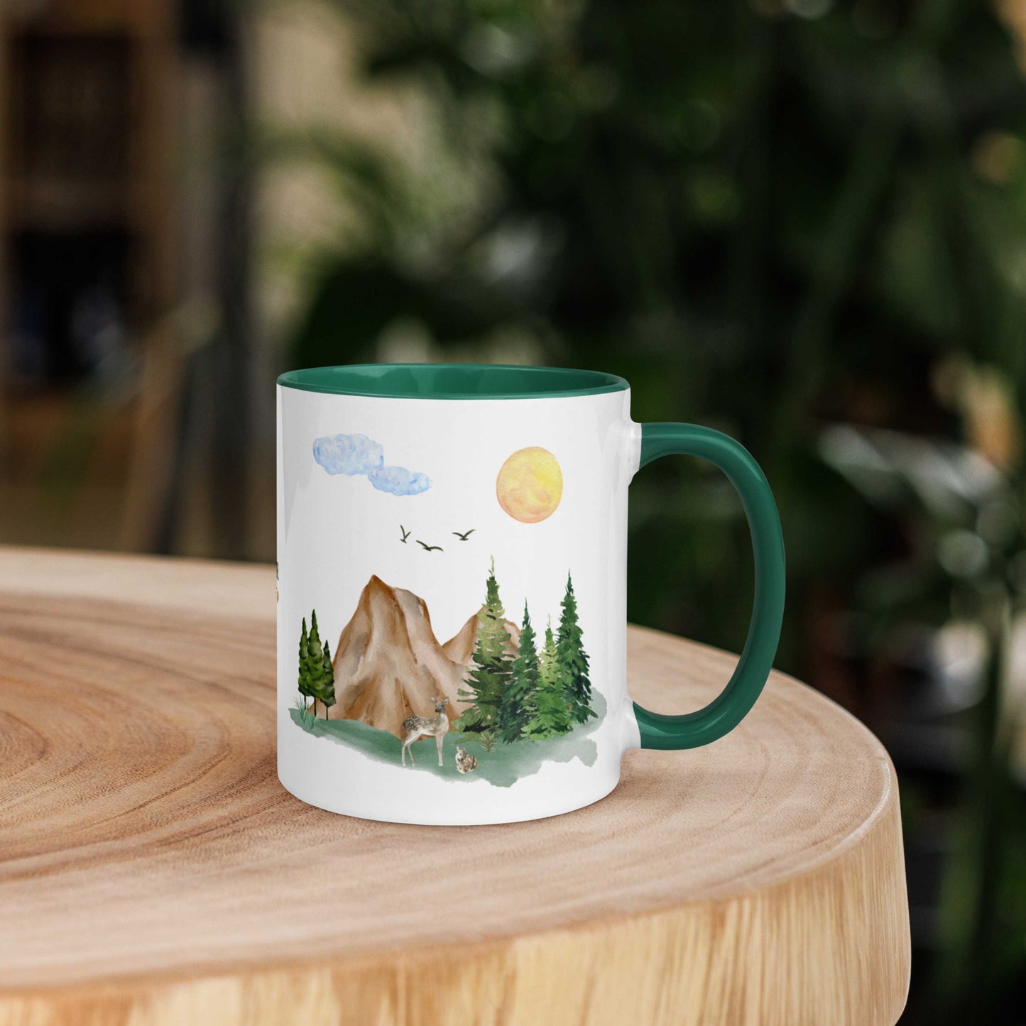Ceramic Mug featuring a nature scene with trees, mountains, and a deer.