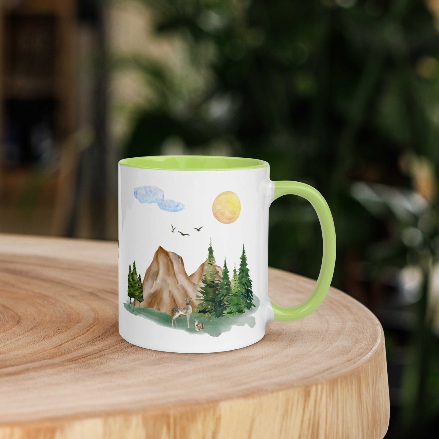 Ceramic Mug featuring a nature scene with trees, mountains, and a deer.