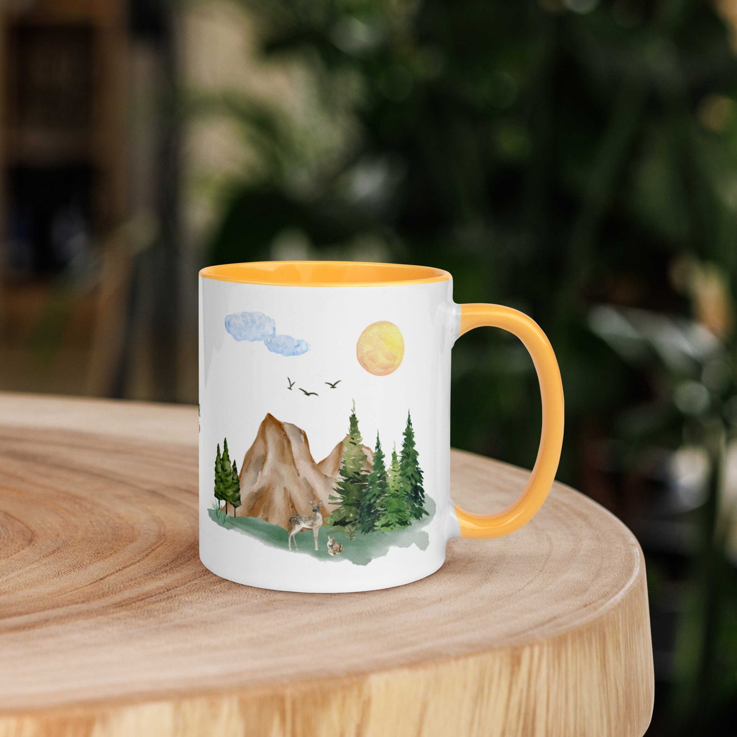 Ceramic Mug featuring a nature scene with trees, mountains, and a deer.