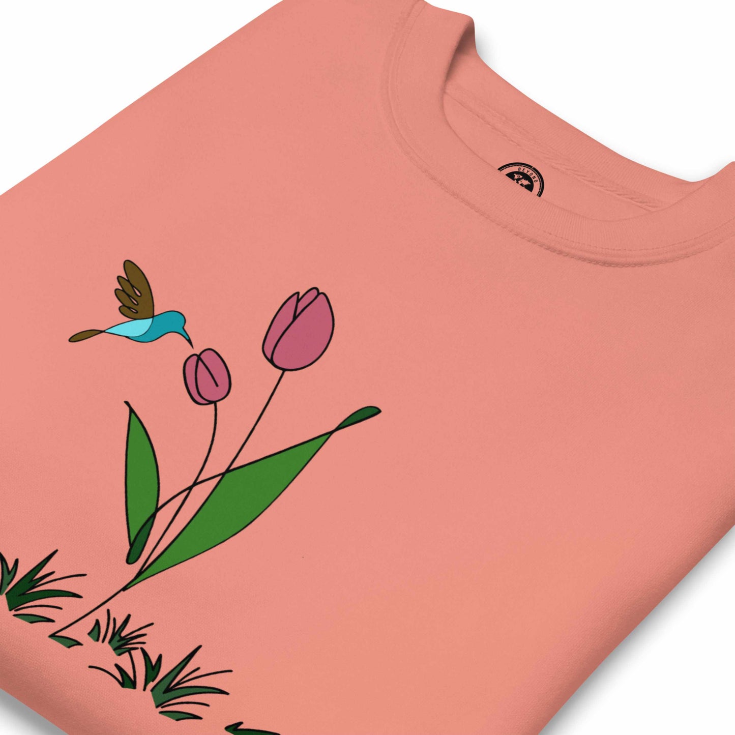 Fresh Feeling design captures a fleeting moment of harmony. Sweatshirt with a floral, hummingbird and tulip design.