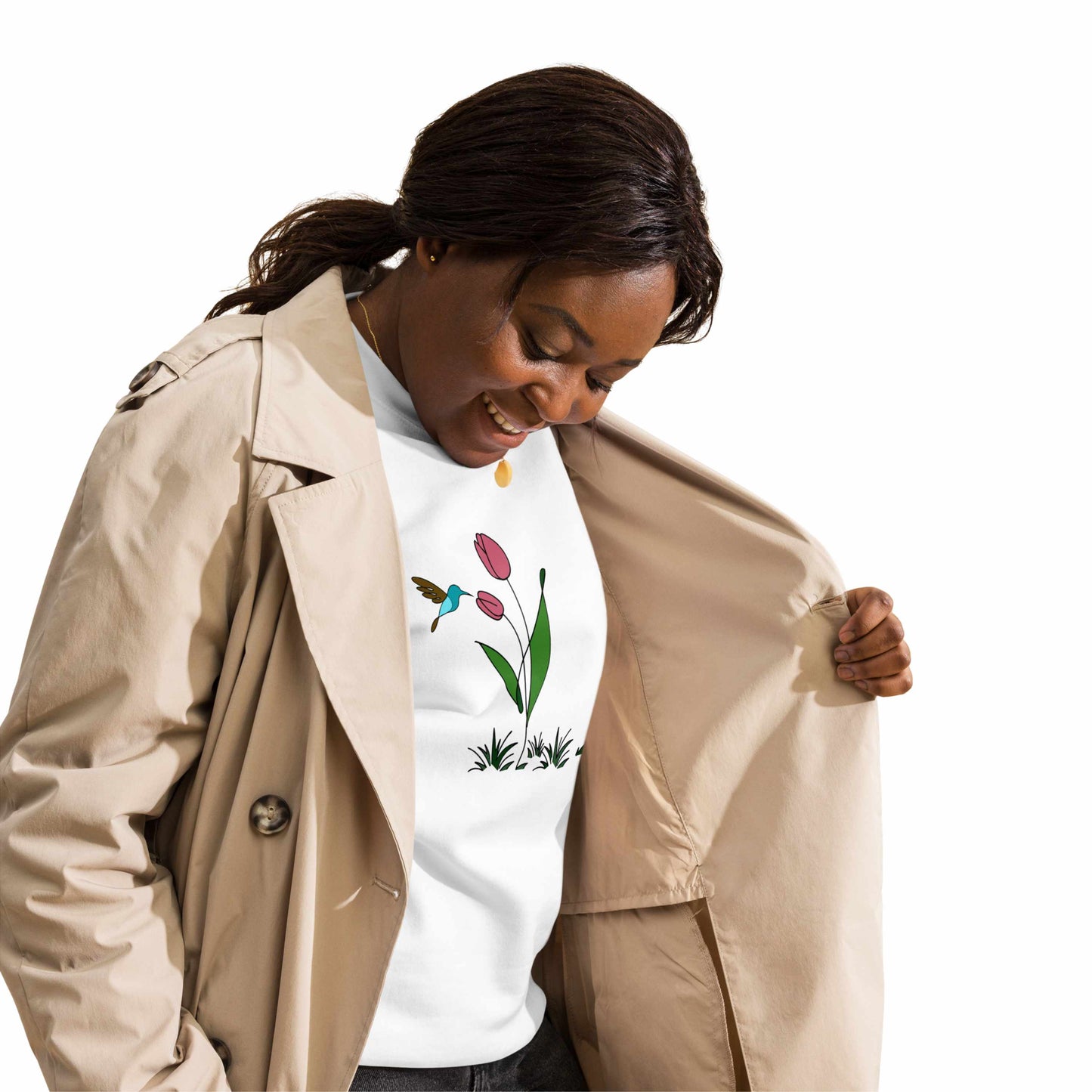 Fresh Feeling design captures a fleeting moment of harmony. Woman wearing sweatshirt with a floral, hummingbird and tulip design.