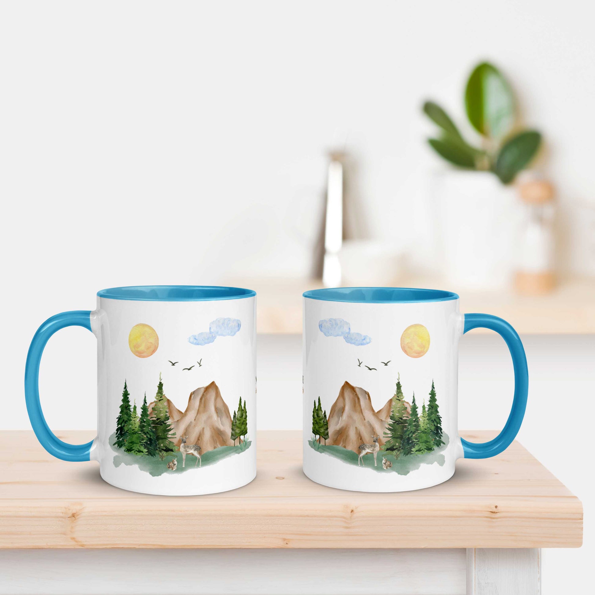 Ceramic Mug featuring a nature scene with trees, mountains, and a deer.