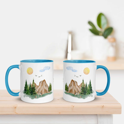 Ceramic Mug featuring a nature scene with trees, mountains, and a deer.