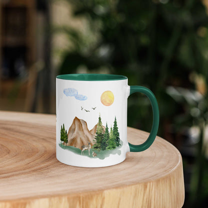 Ceramic Mug featuring a nature scene with trees, mountains, and a deer.