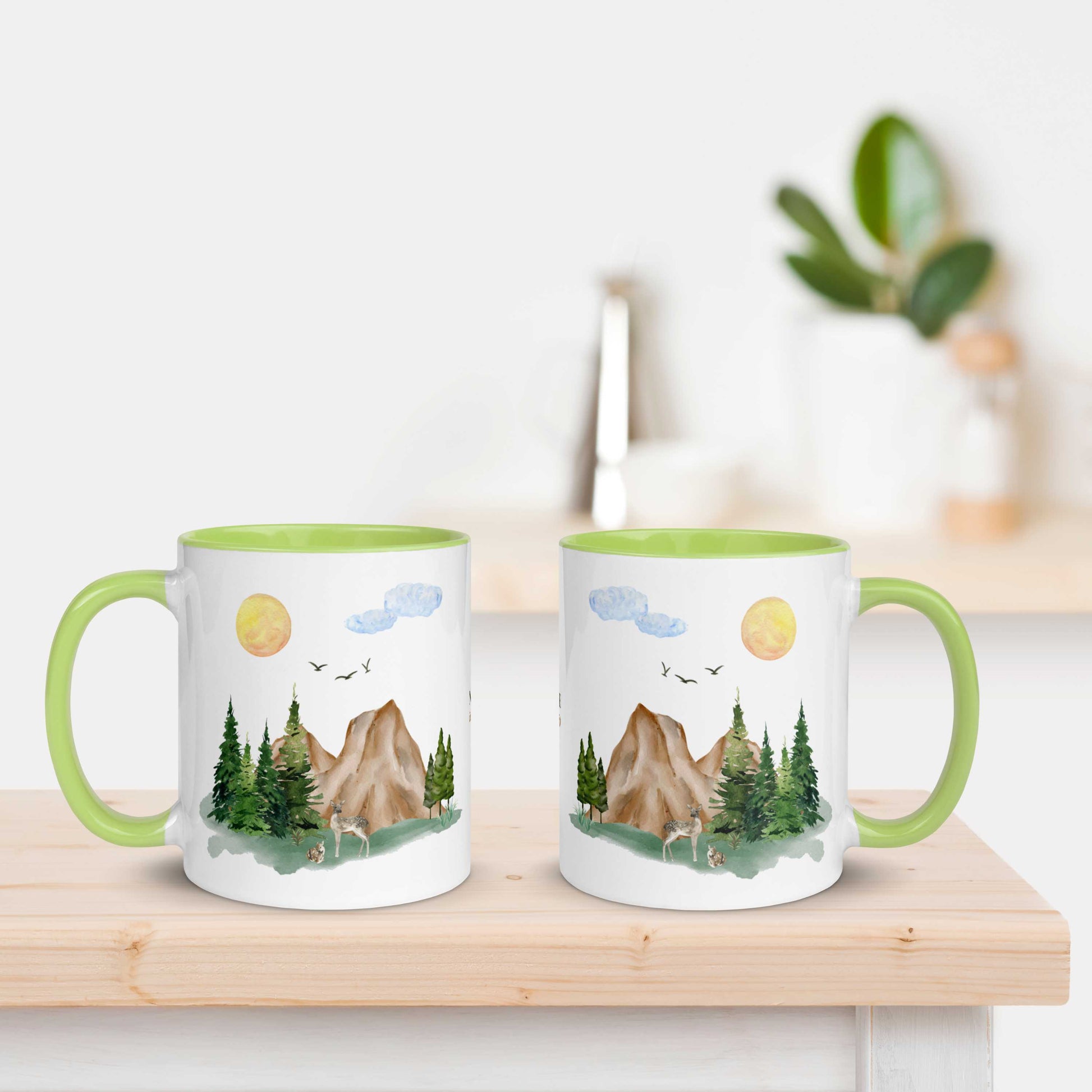 Ceramic Mug featuring a nature scene with trees, mountains, and a deer.