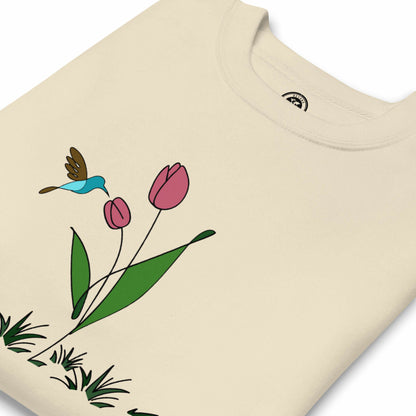 Fresh Feeling design captures a fleeting moment of harmony. Beige sweatshirt with a floral, hummingbird and tulip design. 