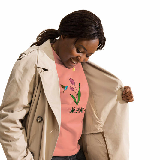 Fresh Feeling design captures a fleeting moment of harmony. Woman wearing sweatshirt with a floral, hummingbird and tulip design. 